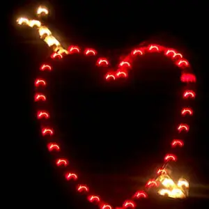 Illuminated heart and arrow decoration