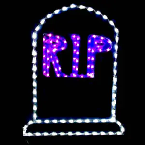 Illuminated RIP sign in darkness