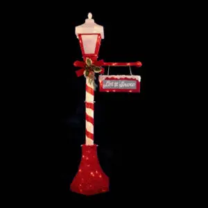Christmas-themed lamppost decoration with red ribbon