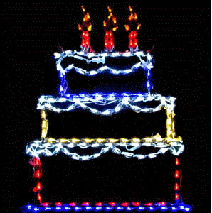 Illuminated three-tier cake with candles